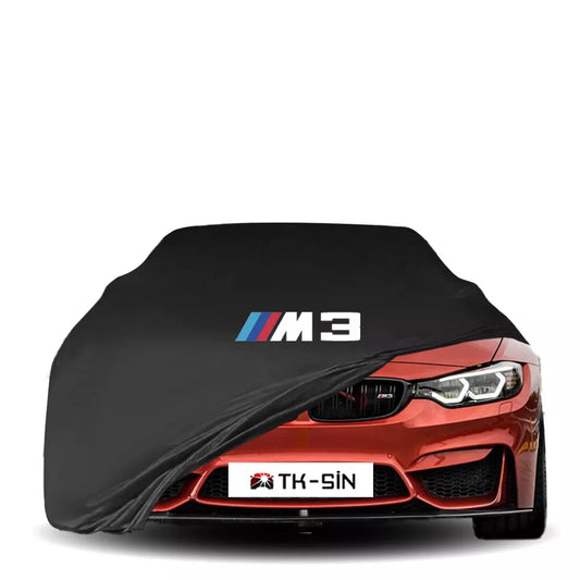 BMW M3 F80 3 Series Sedan fitted with a bespoke indoor car cover in a UK garage
