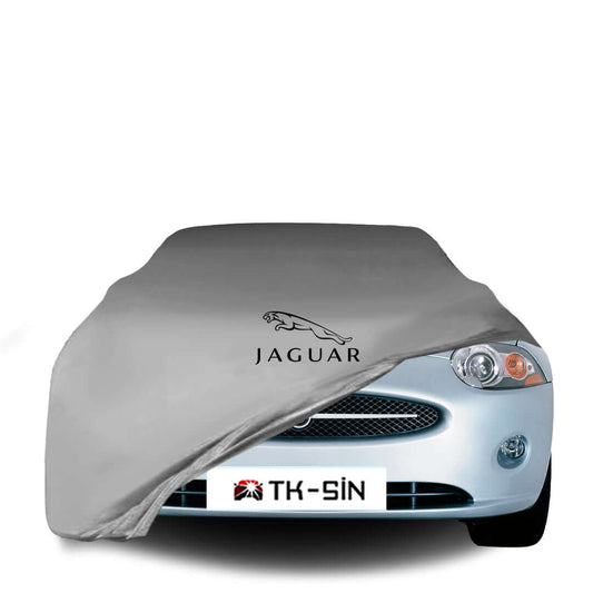 Jaguar XK X150 fitted with a bespoke indoor car cover in a UK garage